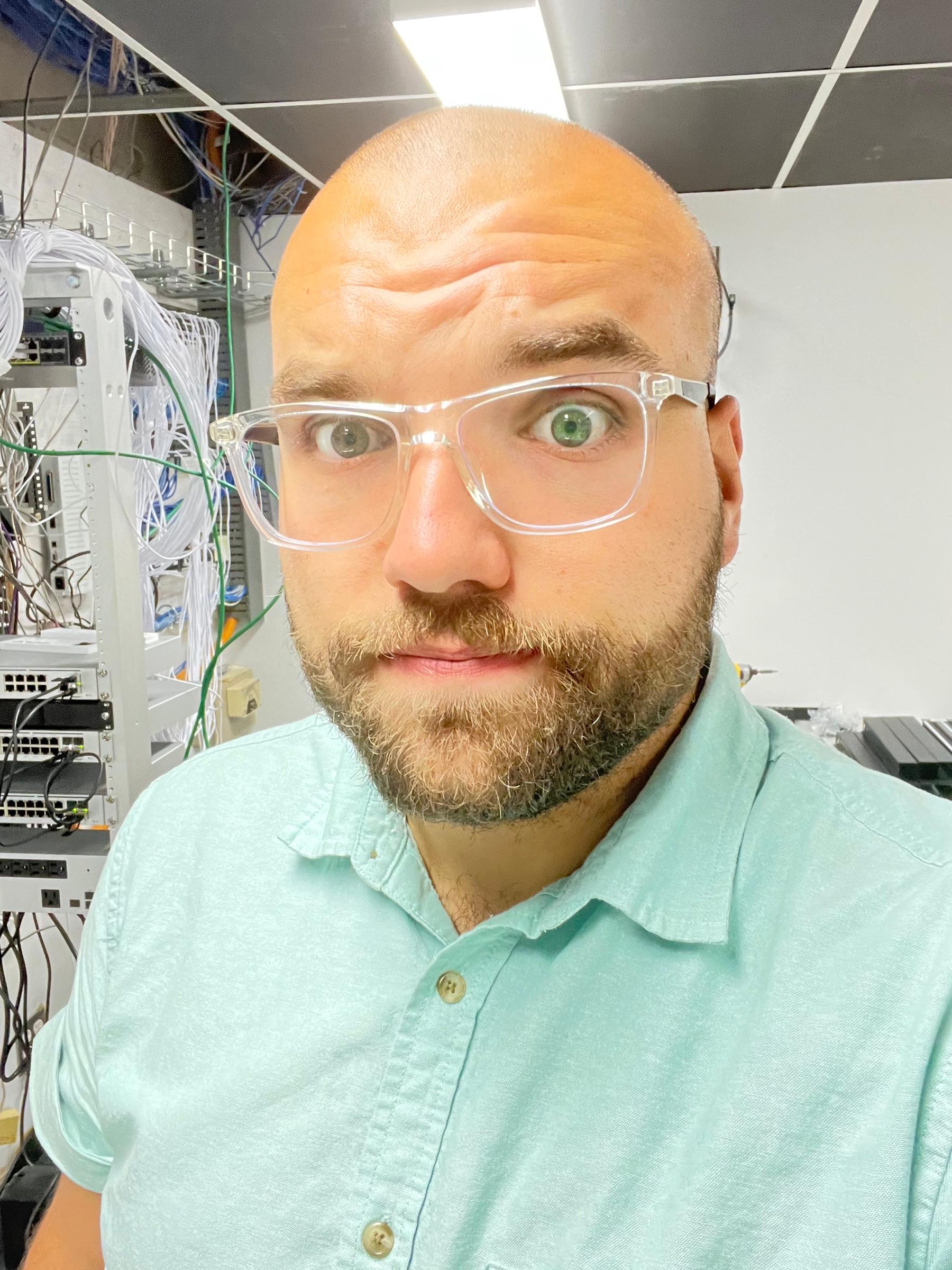 Kenton Batson, FinWell's founder, in a network closet