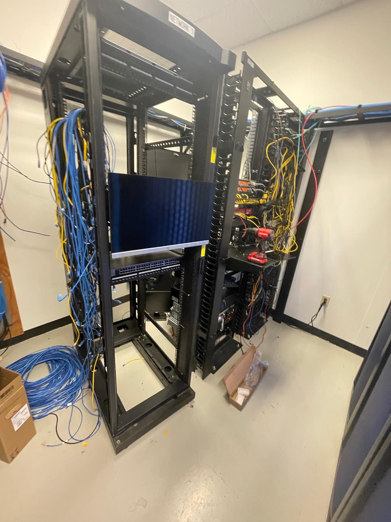 Network racks being built out in a server closet