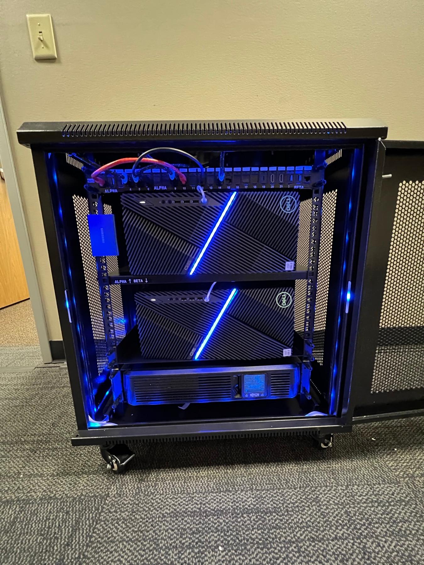 Close-up of network switches and a patch panel with red cabling