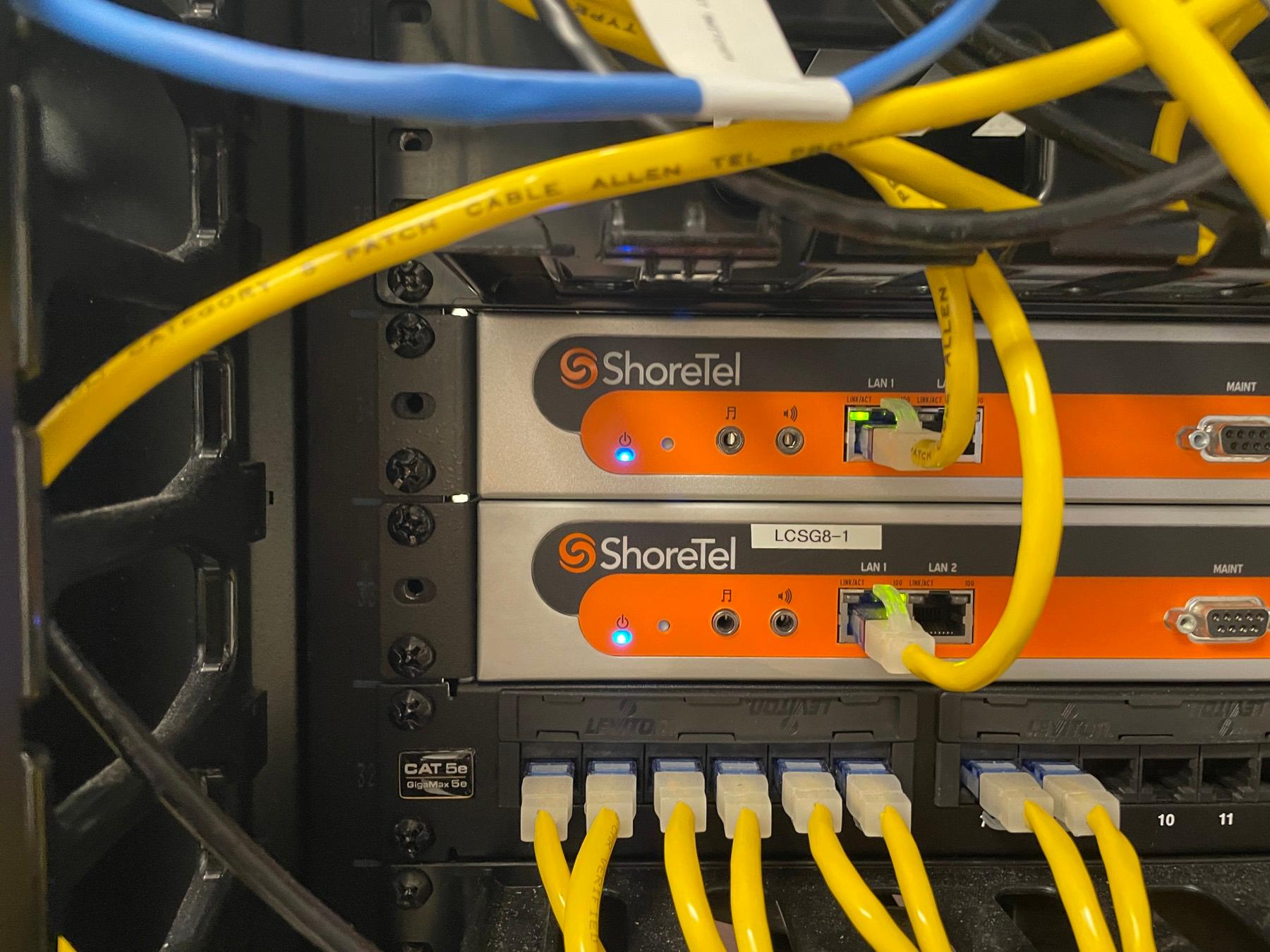 Business VOIP phone system equipment mounted in a network rack